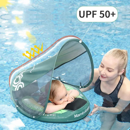 Parent beside a baby resting in the Avocado float under the UPF 50+ canopy