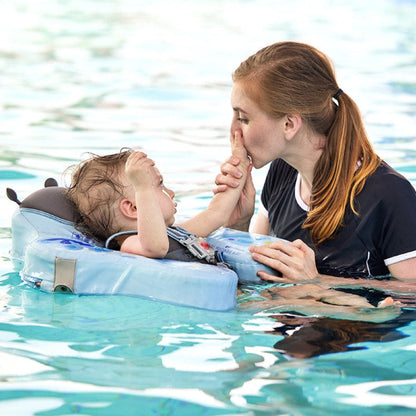 Mother beside her baby in the blue Butterfly float in a pool