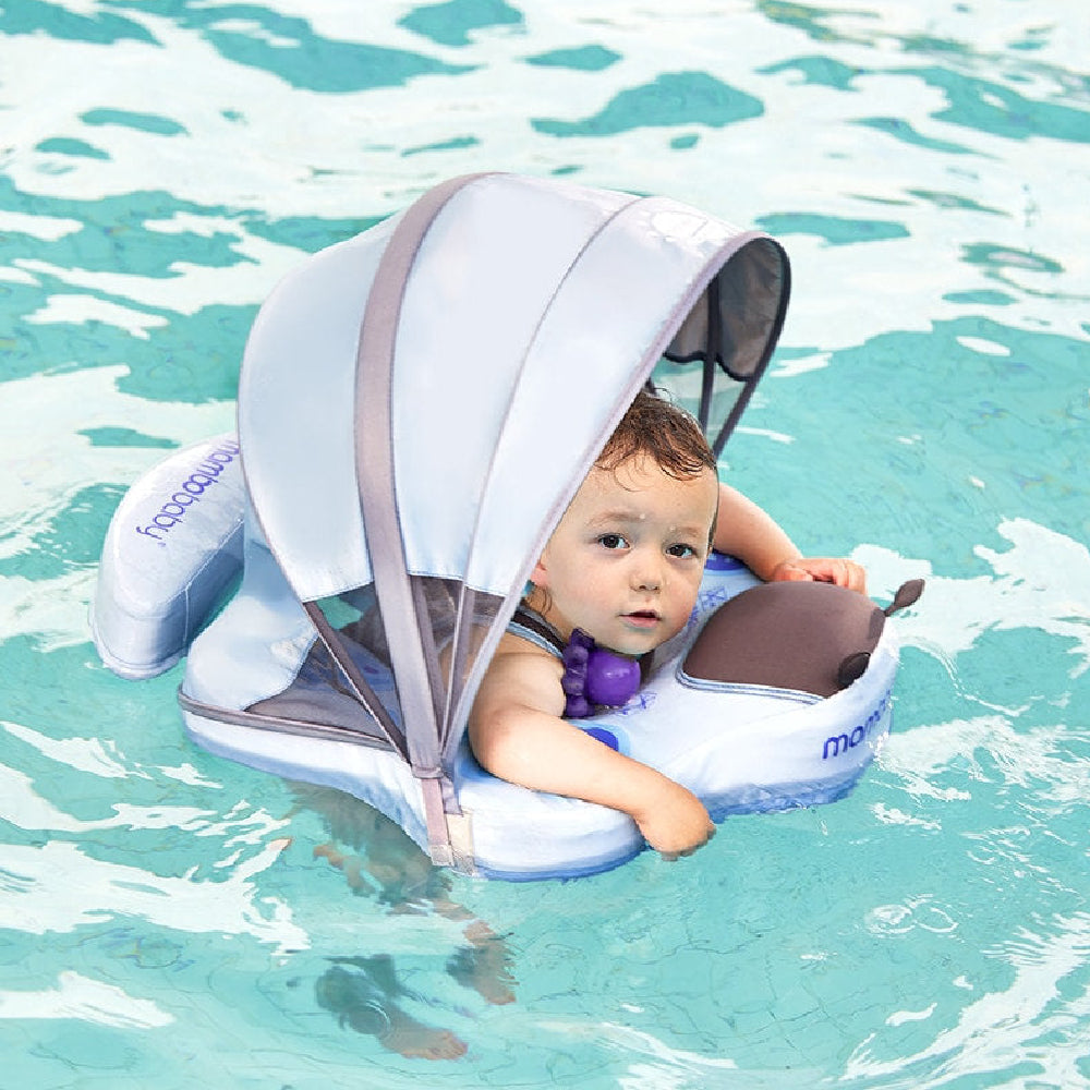 Baby under the UPF 50+ mesh canopy of the Butterfly float
