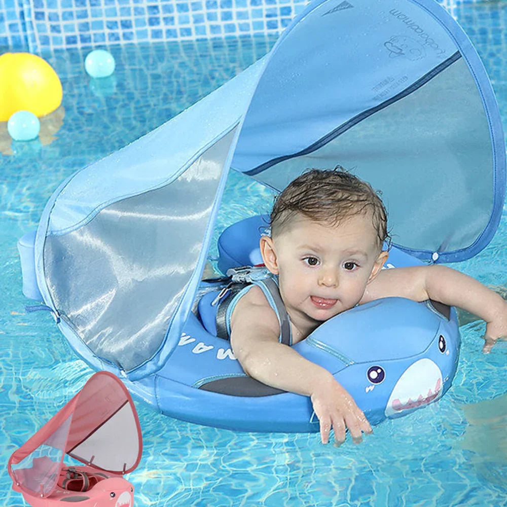 Baby in the blue Shark float in a pool with the UPF 50+ canopy up