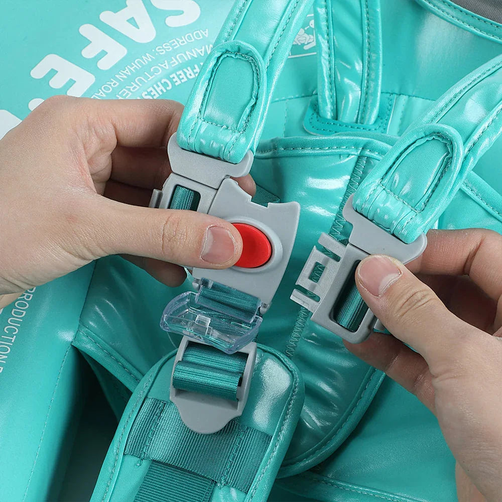 Close-up of the double-lock safety buckle with red release button