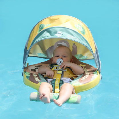 Baby sitting in the Mambobaby Sloth float in a pool with the sun canopy up